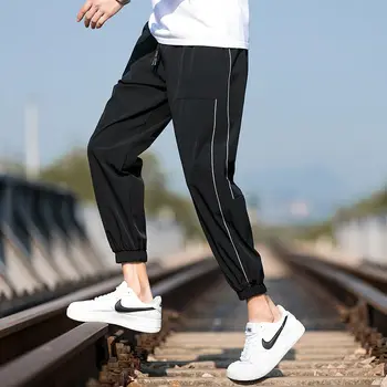 Летни мъжки ежедневни панталони 2023, Корейското издание, модерен тънък панталон Ice Silk, свободни завязки на краката си, спортни удобни Универсални скъсяване на панталон